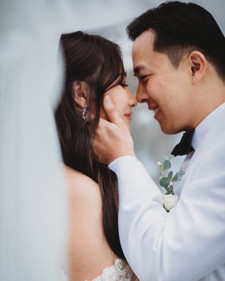 Newlyweds sharing a romantic moment during their wedding photo session